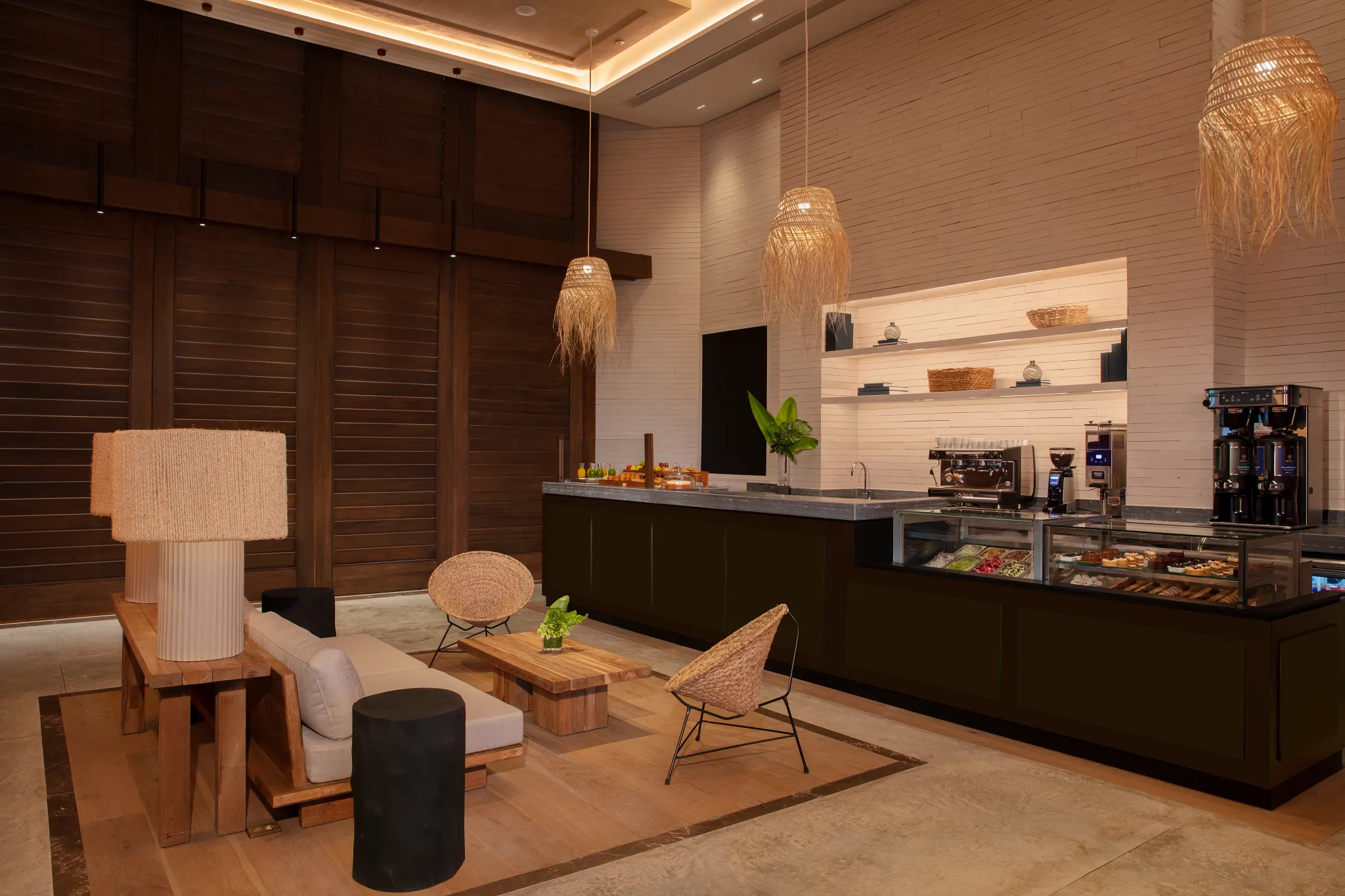 Coco Café at Secrets Moxché Playa del Carmen featuring a modern coffee bar with espresso machines, pastries, and comfortable lounge seating.