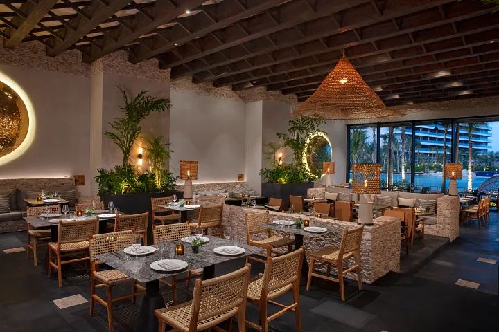 Dos Almas Mexican restaurant at Secrets Moxché Playa del Carmen featuring elegant rustic décor, woven lighting, and a modern Mexican dining atmosphere.