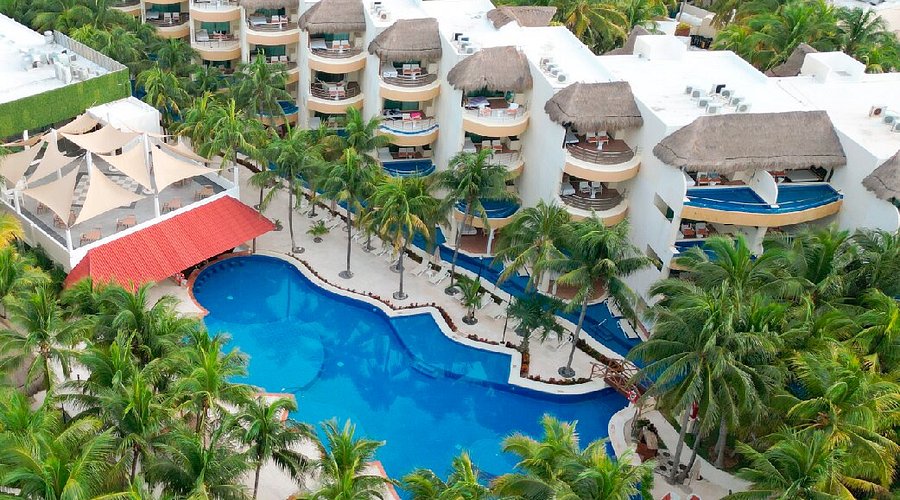 El Dorado Maroma adults-only beachfront resort with palapa-style architecture, pristine Maroma Beach, and intimate luxury atmosphere on the Riviera Maya.