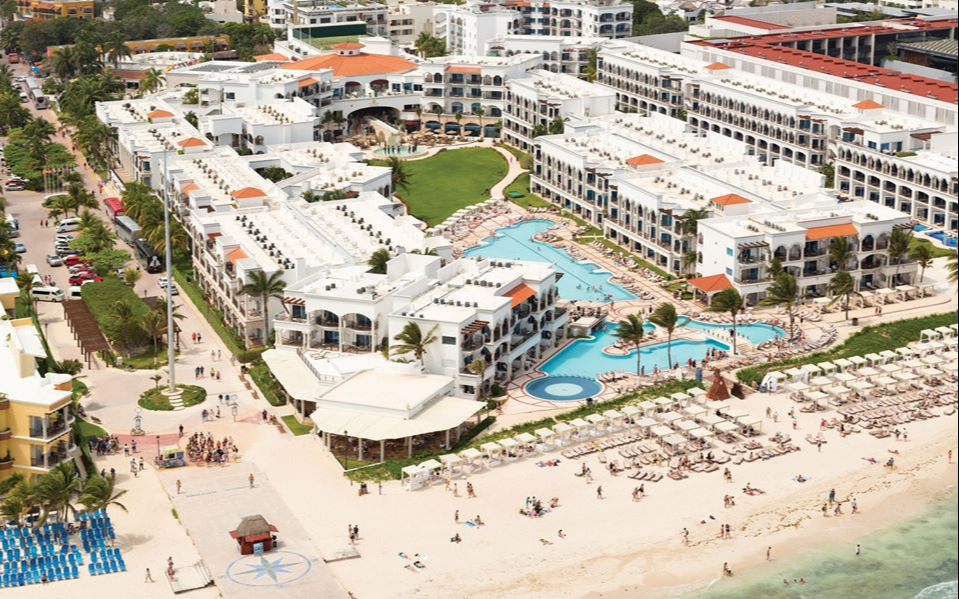 Hilton Playa del Carmen adults-only all-inclusive resort with beachfront pools, modern design, and prime 5th Avenue location.