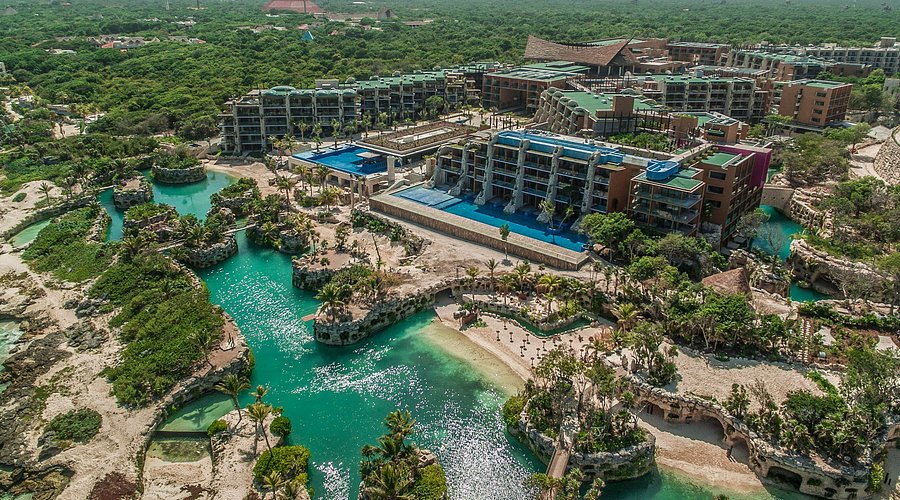 Hotel Xcaret Mexico all-inclusive eco-resort with winding rivers, natural pools, jungle setting, and unlimited access to Xcaret parks.