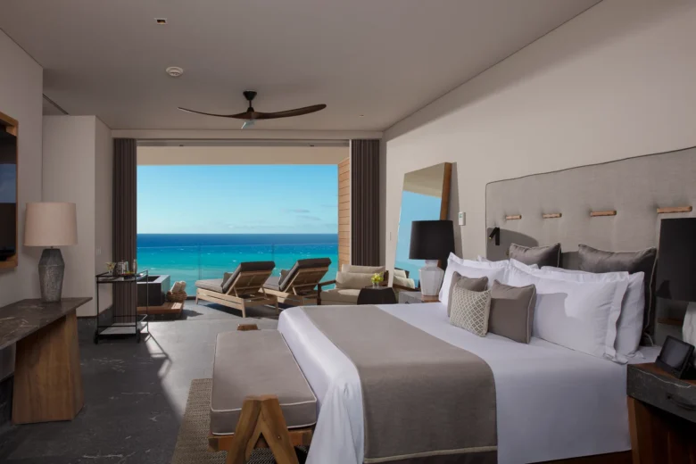 Preferred Club Master Suite Oceanfront bedroom with king bed and terrace overlooking the Caribbean at Secrets Moxché Playa del Carmen.