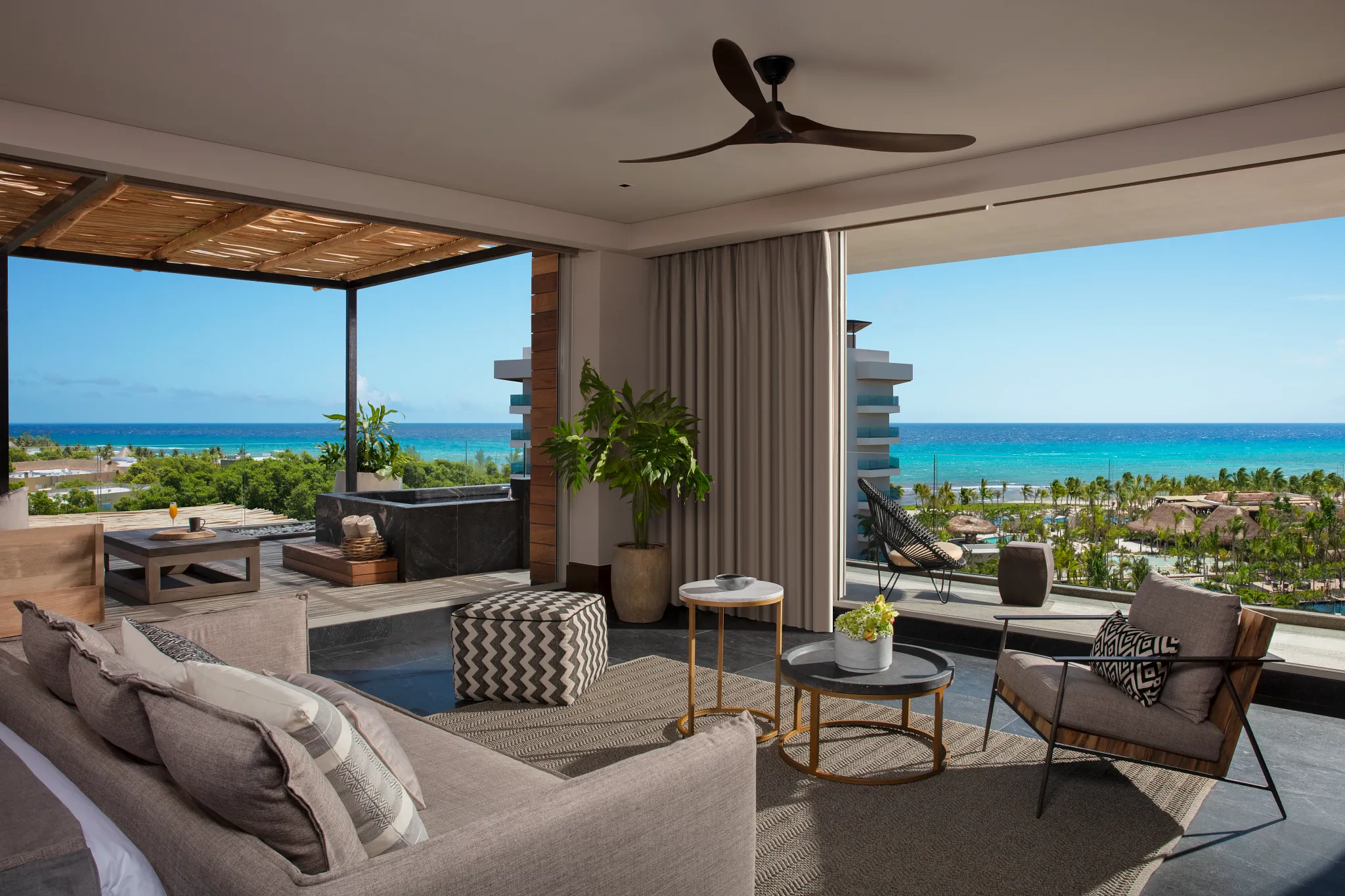 Preferred Club Ocean View Paramount Suite living area with terrace access at Secrets Moxché Playa del Carmen.